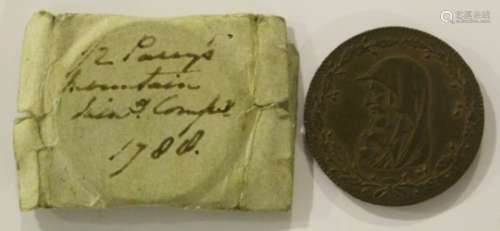 An 18th century Anglesey Mines halfpenny token 1788, with old ink-written label.Buyer’s Premium 29.