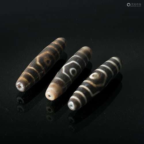 THREE TIBETAN DZI BEADS