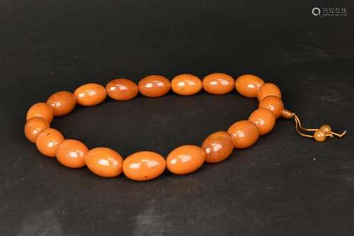 A STRING OF AMBER BEADS