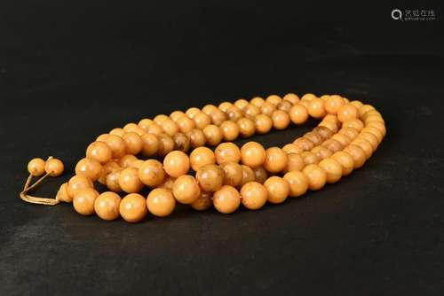 A STRING OF AMBER BEADS