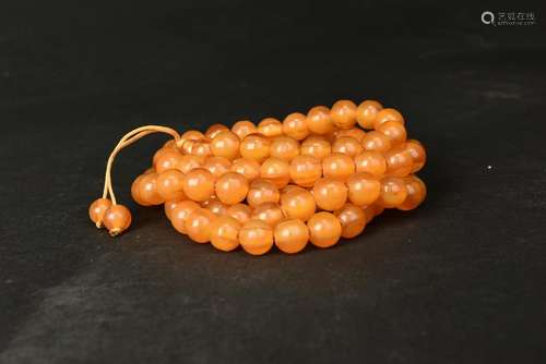 S STRING OF AMBER BEADS