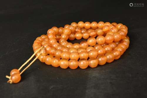 A STRING OF AMBER BEADS