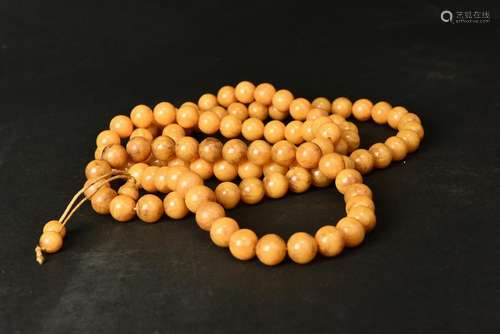 A STRING OF AMBER BEADS