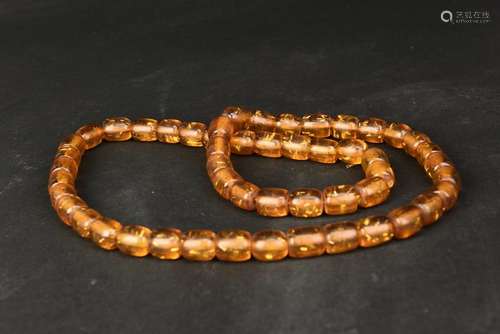 A STRING OF AMBER BEADS