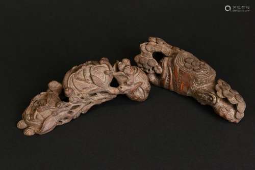 A PAIR OF CARVED BAMBOO PAPER WEIGHTS