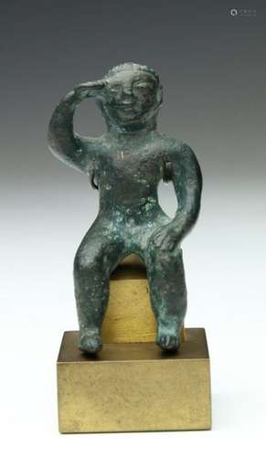 Antique bronze statue of a seated figure, possibly…