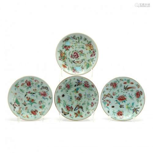 A Group of Four Chinese Celadon Plates with Butterflies