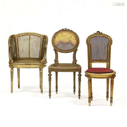 Three Louis XVI Style Carved and Gilt Cane Seat Chairs