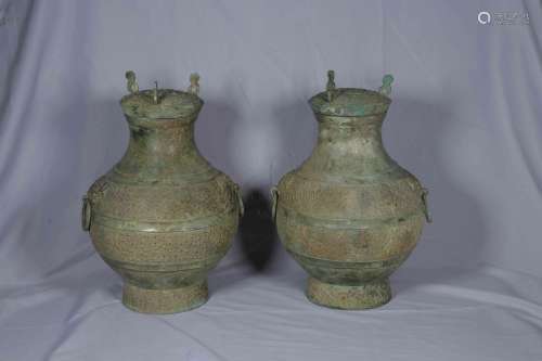 TWO ARCHAIC BRONZE CAST JARS WITH LID