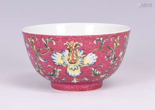 FAMILLE ROSE AND RED GROUND 'FLOWERS' BOWL