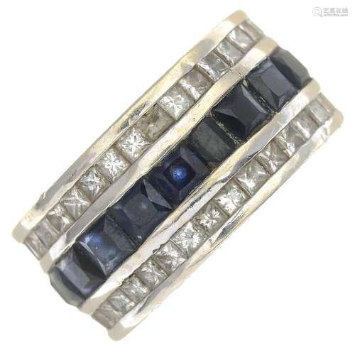 (23348) A sapphire and diamond ring.Estimated total diamond weight 3.60cts.Stamped 14K.Ring size