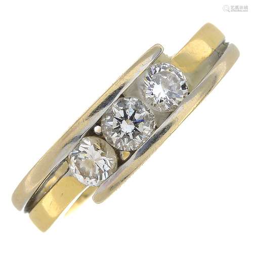 (23449) An 18ct gold three-stone diamond ring.Estimated total diamond weight 0.60ct.Hallmarks for