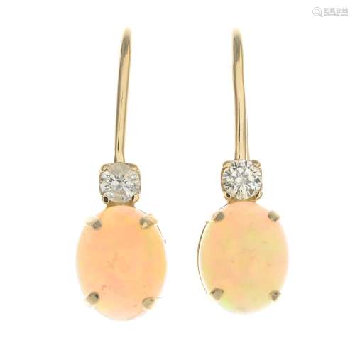 A pair of opal and diamond earrings.Estimated total diamond weight 0.36ct,