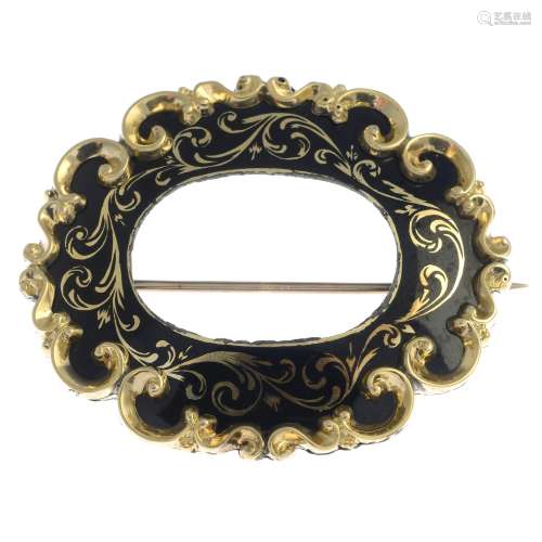 A late Victorian gold and enamel mourning brooch.Length 4.5cms.