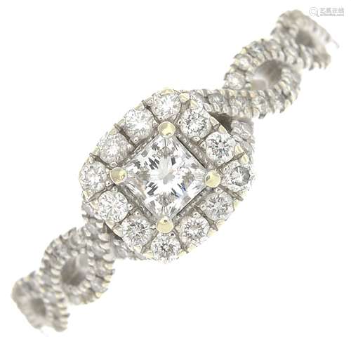 (65219) A 14ct gold diamond cluster ring.Total diamond weight 0.69ct, stamped to band.