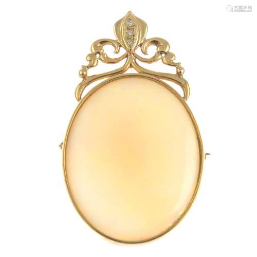 A 9ct gold opal and diamond pendant.May also be worn as a brooch.Hallmarks for Sheffield,