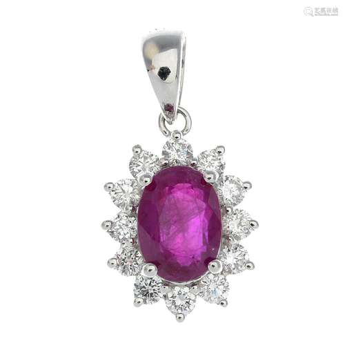 An 18ct gold ruby and diamond cluster pendant.Total diamond weight 0.28ct, stamped to surmount.