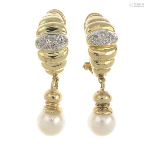 A pair of cultured pearl and diamond earrings.One AF.Cultured pearls approximate diameter