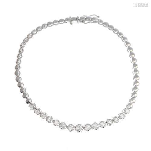 A diamond bracelet.Estimated total diamond weight 0.55ct.Stamped 14K.Length 17.5cms.