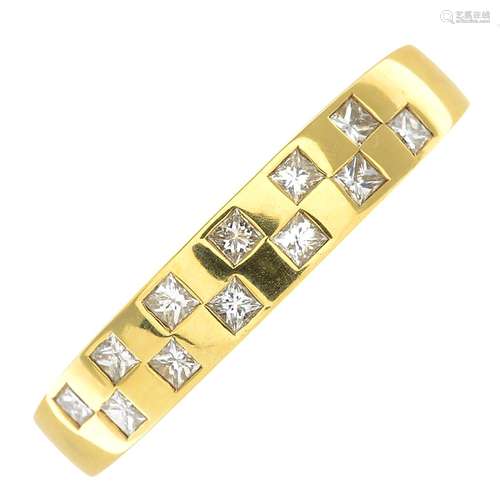 An 18ct gold diamond band ring.