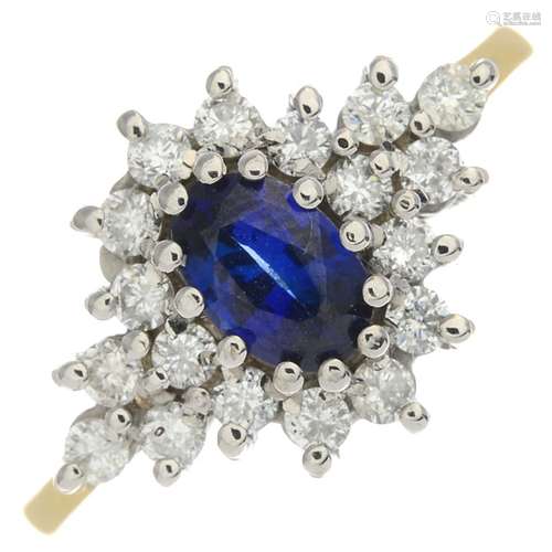 An 18ct gold sapphire and diamond cluster ring.Calculated sapphire weight 0.60ct,