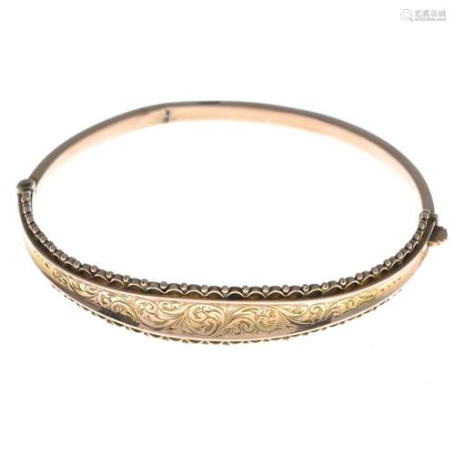 A 9ct gold early 20th century hinged bangle.Hallmarks for Birmingham, 1913.Inner diameter 6cms.