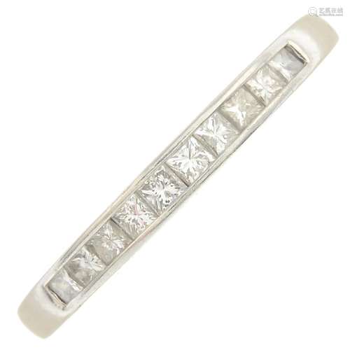 A platinum diamond half eternity ring.