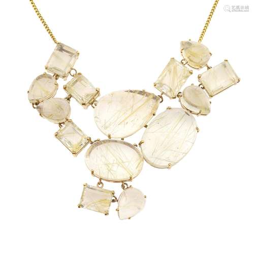 A 9ct gold rutilated quartz necklace.Principal pear rutilated quartz cabochon calculated weight