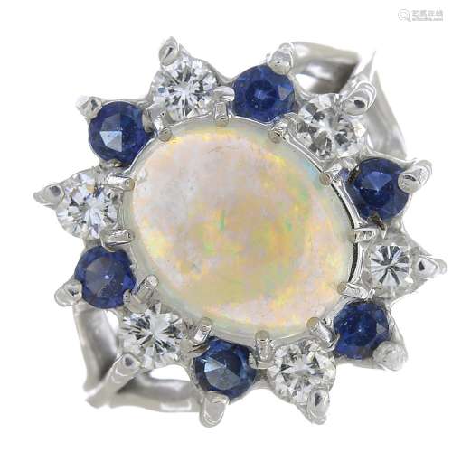 An opal, sapphire and diamond cluster ring.Approximate dimensions of opal 9.7 by 7.8 by