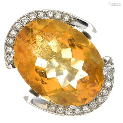 An 18ct gold citrine and diamond dress ring.Citrine calculated weight 17.03cts,