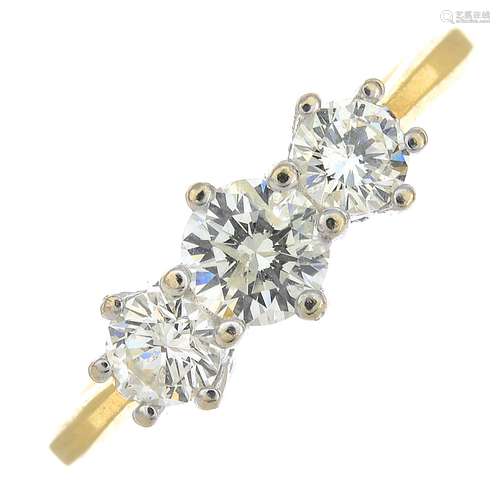 An 18ct gold diamond three-stone ring.Total diamond weight 0.75ct,