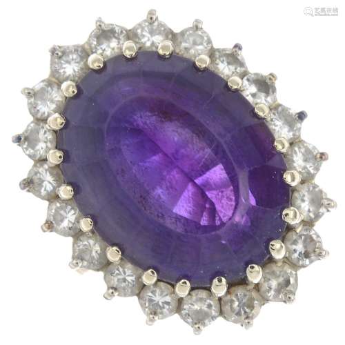 An 18ct gold amethyst and diamond cluster ring.Amethyst calculated weight 13.32cts,