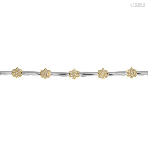 An 18ct gold bi-colour diamond star bracelet.Total diamond weight 0.50ct,