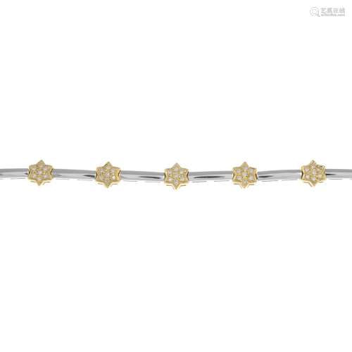 An 18ct gold bi-colour diamond star bracelet.Total diamond weight 0.50ct,