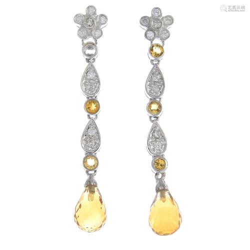 A pair of citrine and diamond drop earrings.One citrine deficient.