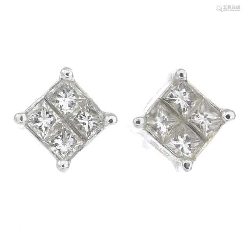 A pair of diamond cluster earrings.Estimated total diamond weight 0.25ct,