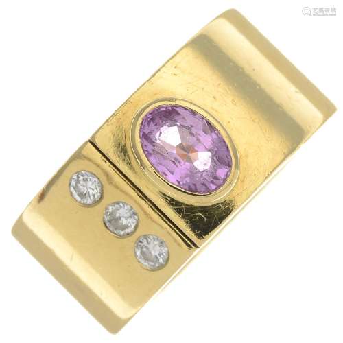An 18ct gold pink sapphire and diamond ring.Calculated pink sapphire weight 0.84ct,