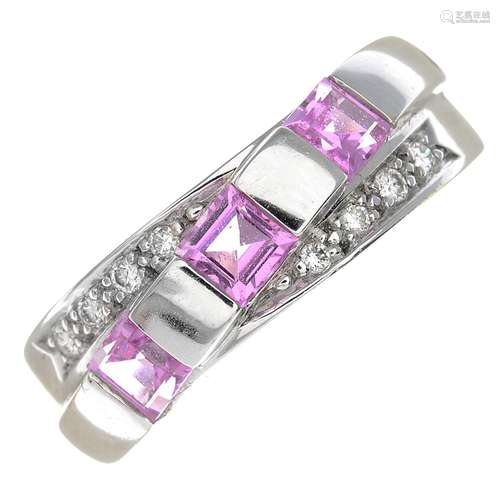 An 18ct gold pink sapphire and diamond dress ring.Sapphire total calculated weight 0.54cts,