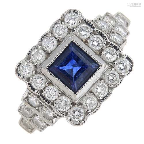 A sapphire and diamond dress ring.Sapphire calculated weight 0.51ct,