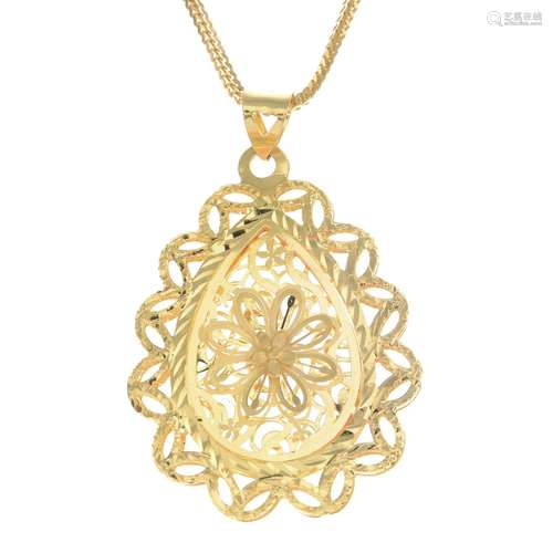 A floral pendant, suspended from a fancy-link chain.Stamped 21K.Length of pendant 4cms.