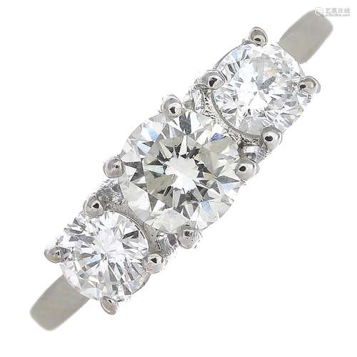 An 18ct gold brilliant-cut diamond three-stone ring.Estimated total diamond weight 1.10cts,