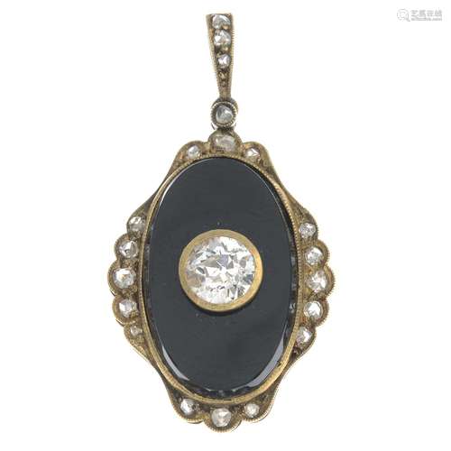 A diamond and onyx pendant.Estimated total diamond weight 0.55ct,