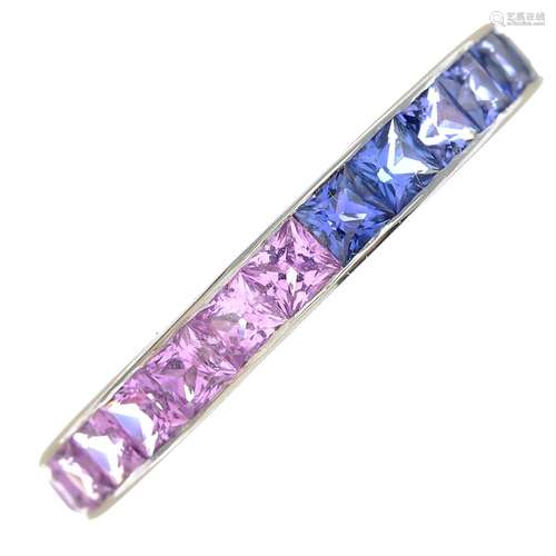 A pink and blue sapphire full eternity ring.Hallmarks for London, 2003.