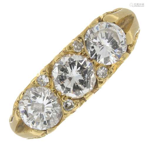 An 18ct gold diamond three-stone ring.Estimated total diamond weight 1.65cts,