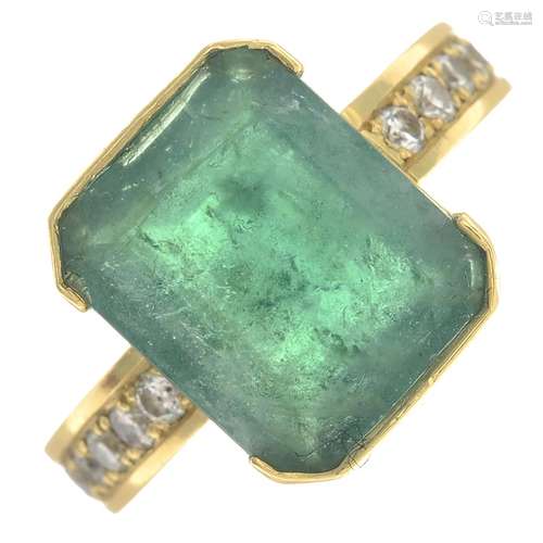 An emerald and diamond dress ring.Emerald calculated weight 5.88cts,