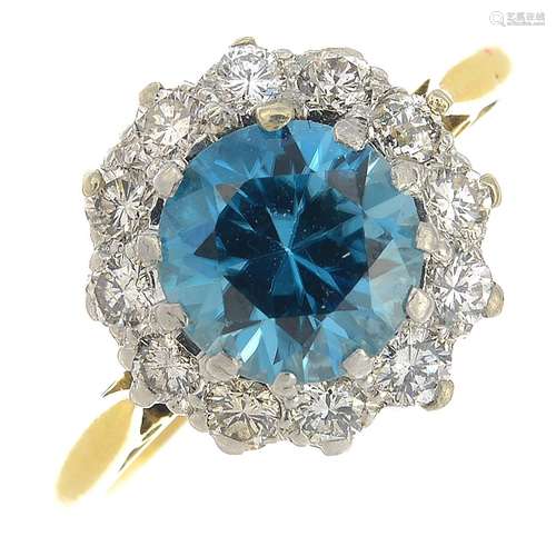 A zircon and diamond cluster ring.Zircon weight 1.93cts.Estimated total diamond weight 0.35ct.Ring