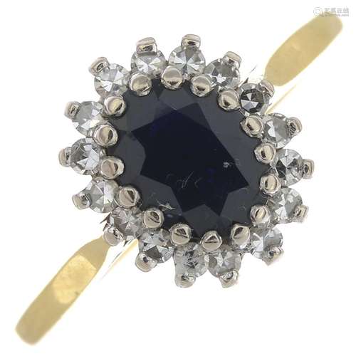 An 18ct gold sapphire and diamond cluster ring.Estimated total diamond weight 0.25ct.Hallmarks for