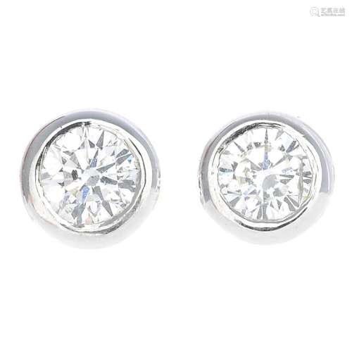 A pair of 18ct gold diamond stud earrings.Estimated total diamond weight 0.50ct,