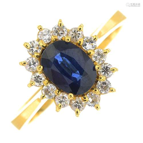 A sapphire and diamond cluster ring.Calculated sapphire weight 1ct,