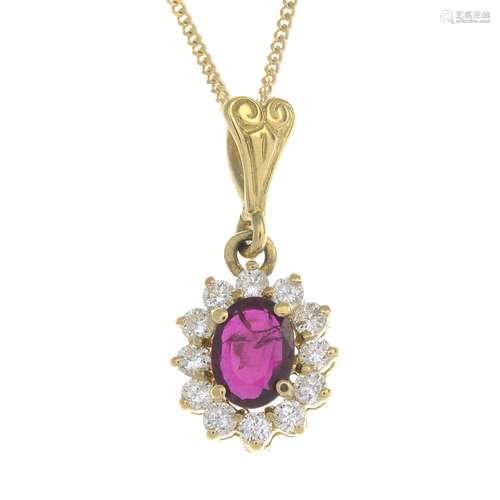 An 18ct gold ruby and diamond pendant,